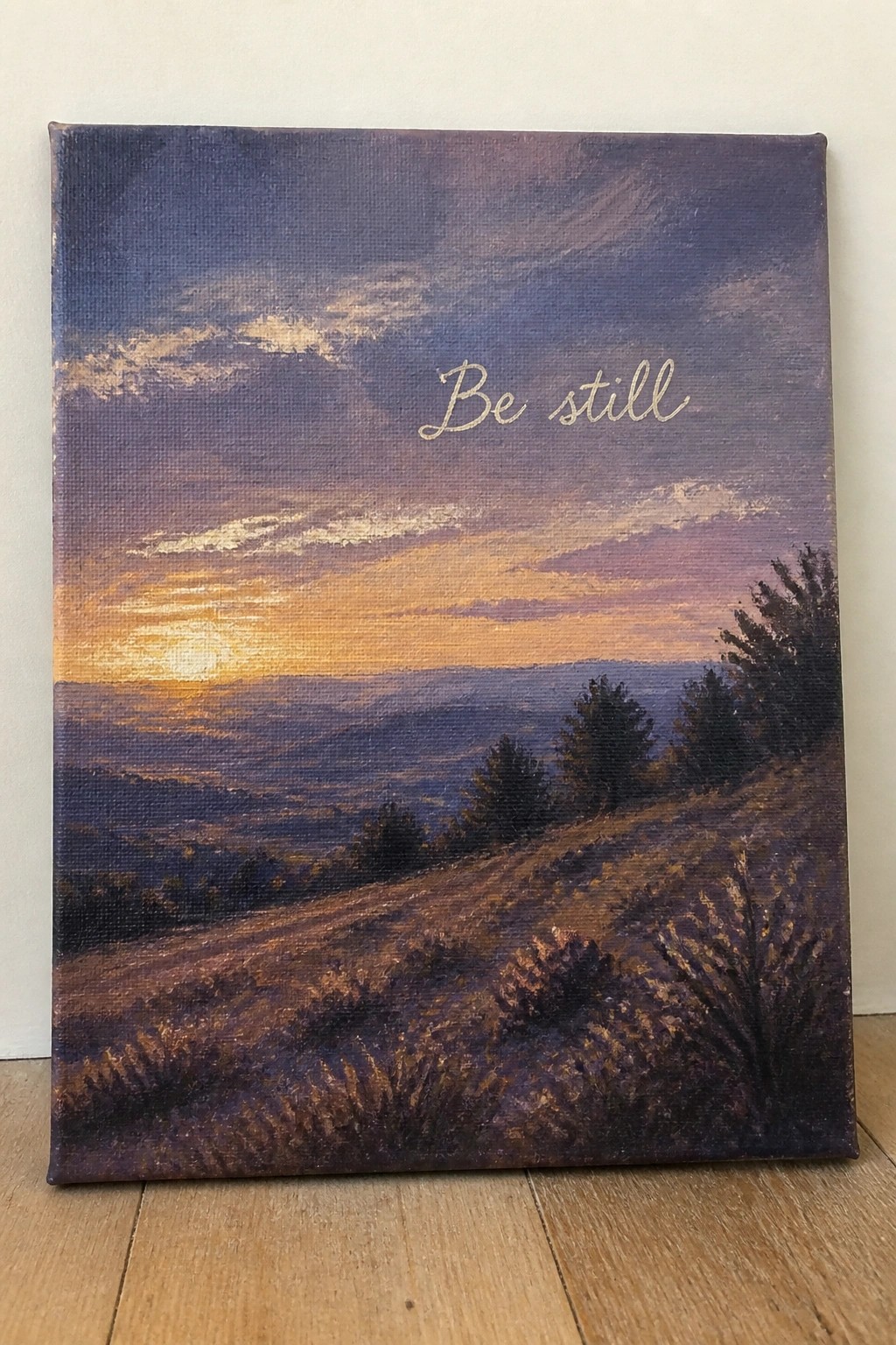 Canvas painting of sunset over purple hills with trees and 