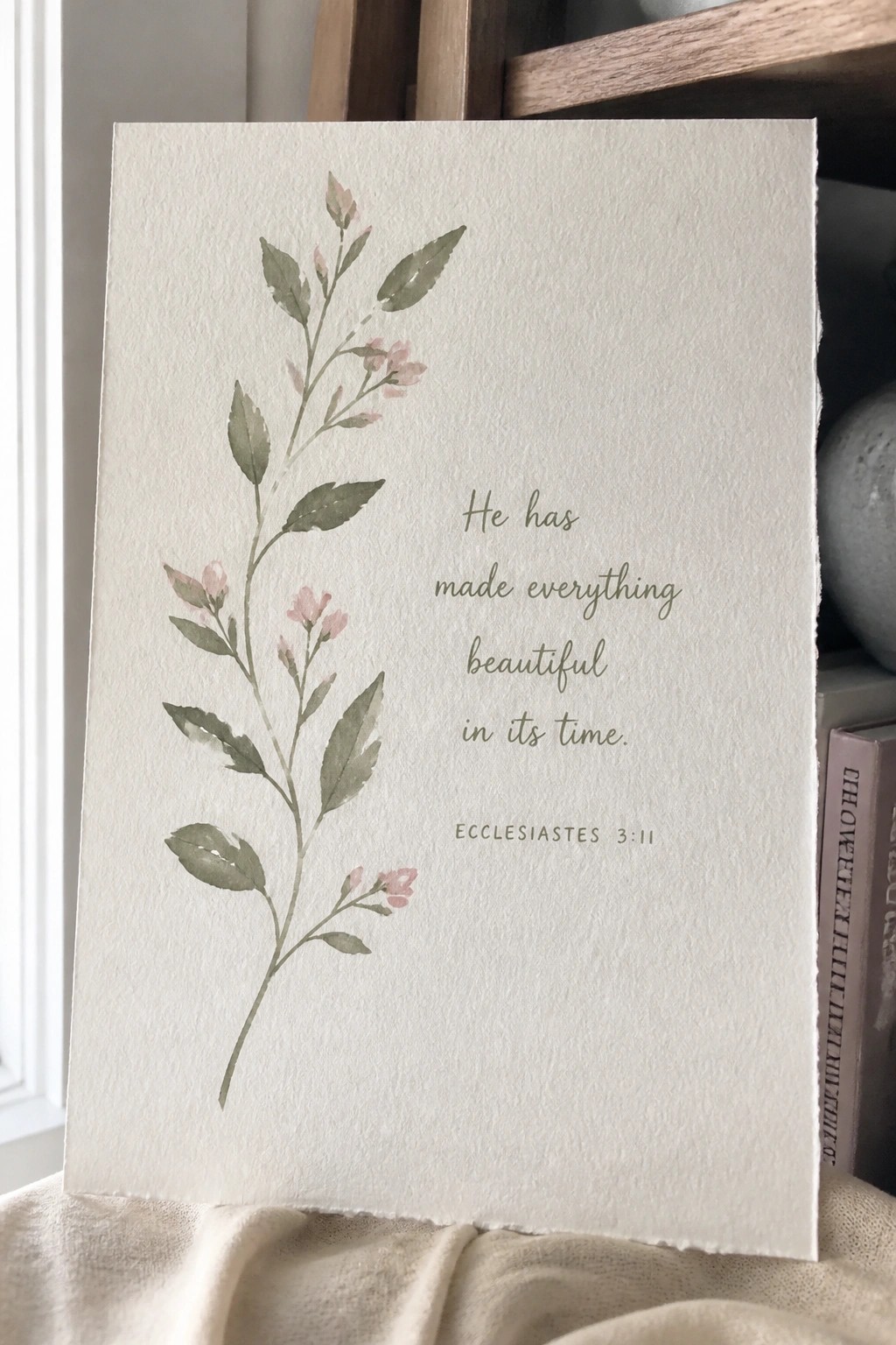White card with watercolor green leaves, pink flowers, and Ecclesiastes 3:11 verse