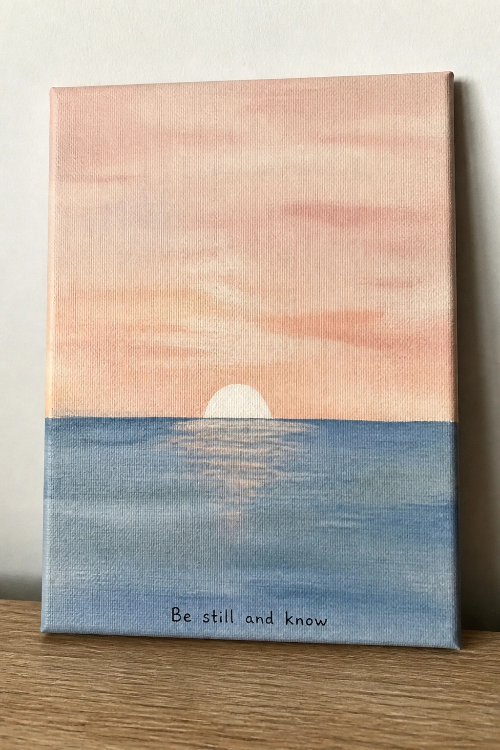 Canvas painting of pink sunset over blue ocean with