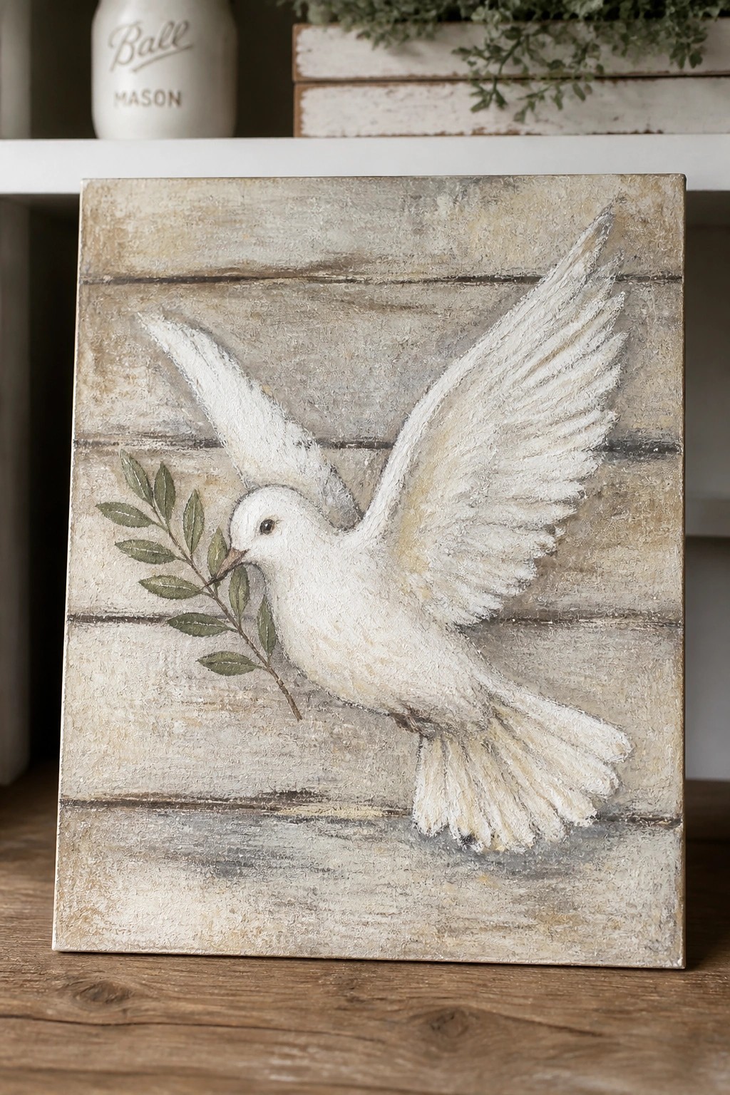 White dove in flight with olive branch on rustic wooden background