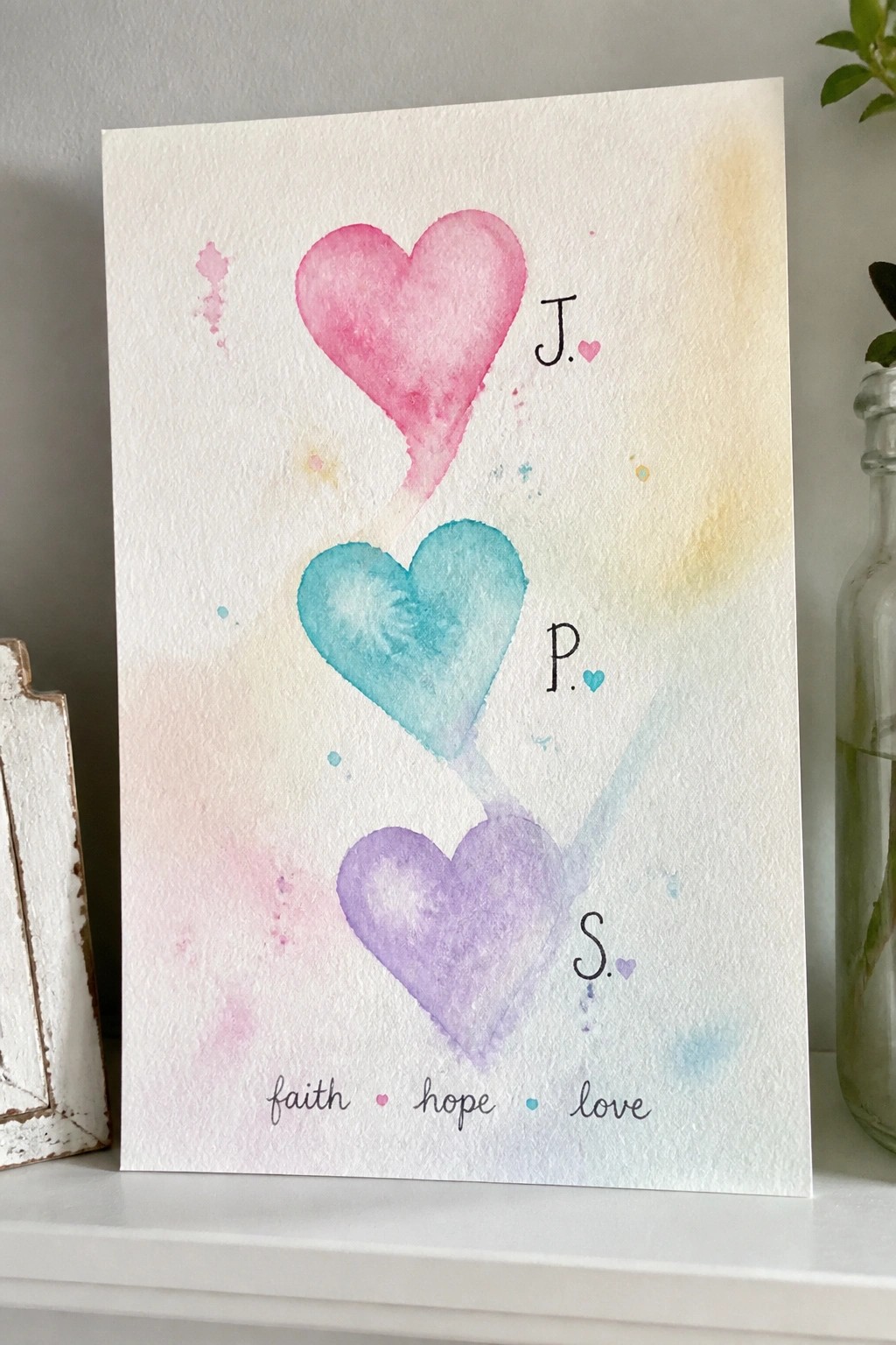 Watercolor hearts in pink teal purple with J P S initials and faith hope love text