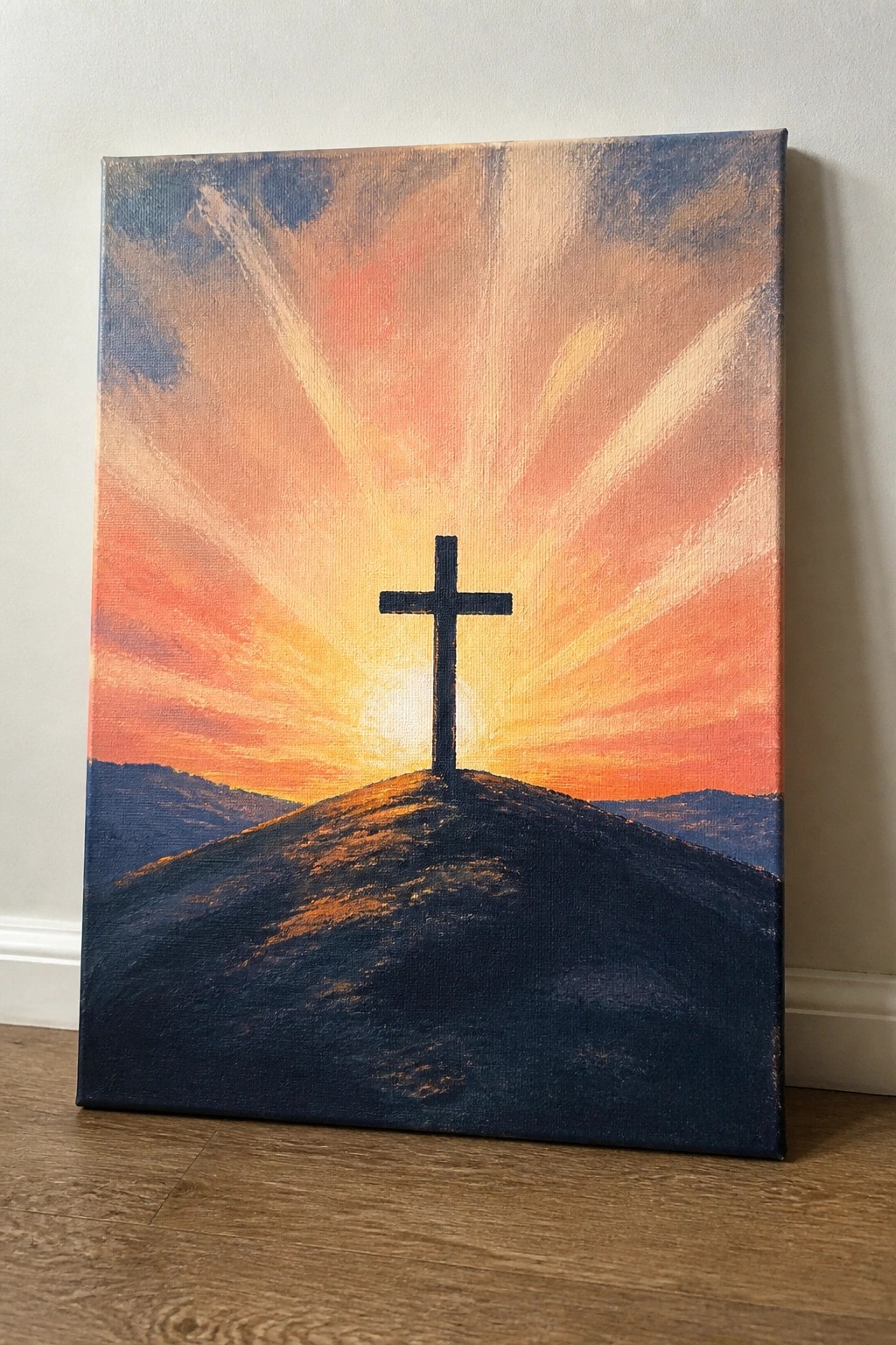 Black cross atop dark hill against vibrant orange-pink sunset with radiating light rays.