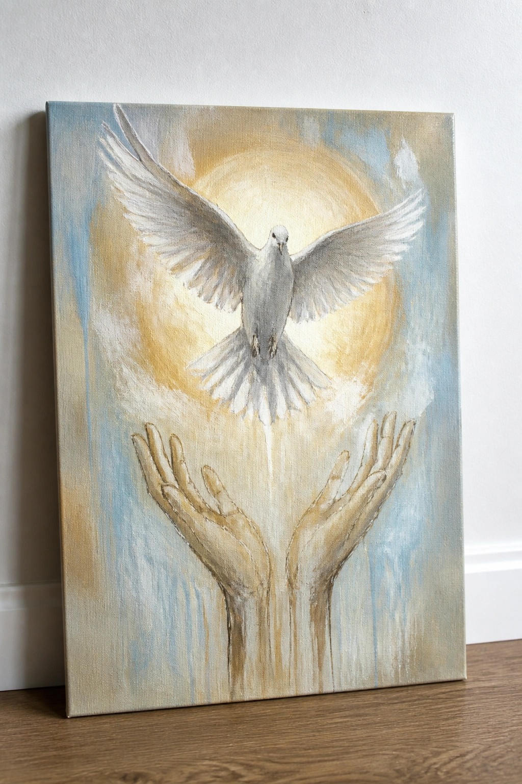 A painting of a white dove with spread wings above two open hands against a soft golden glow on a canvas.