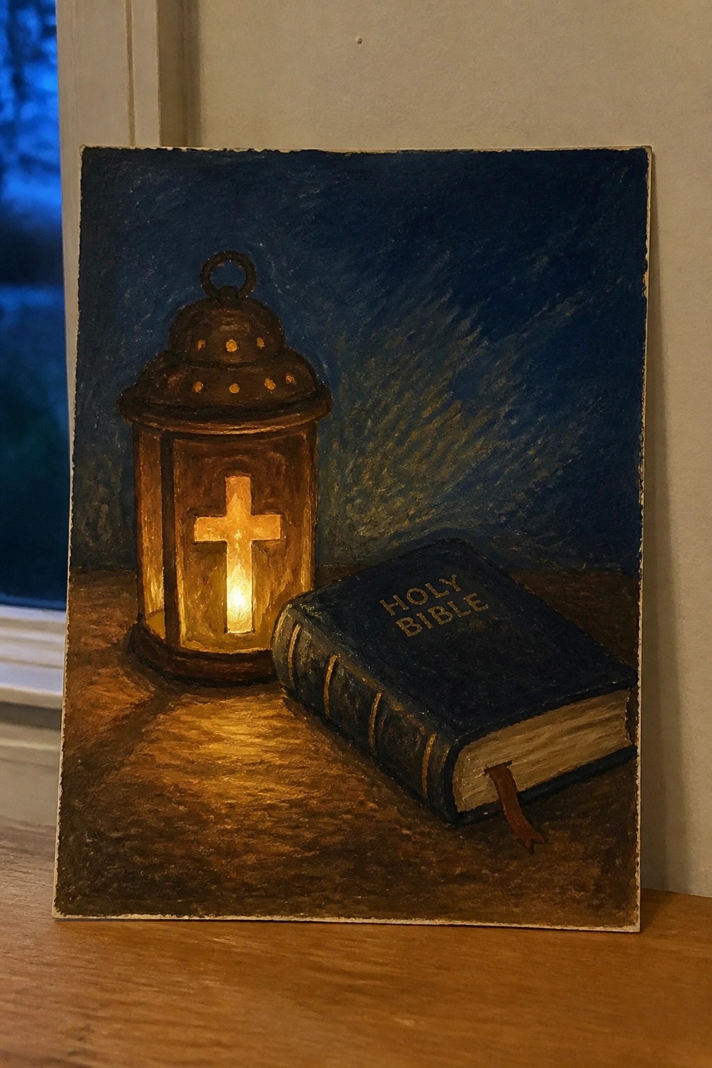 Glowing lantern with cross beside closed Holy Bible on wooden surface