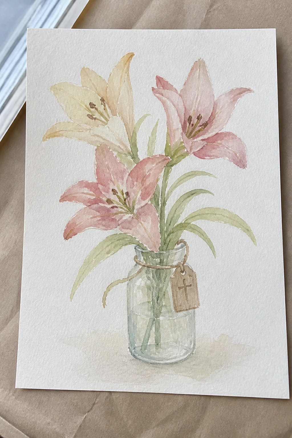 Watercolor painting of pink lilies in a glass jar with cross tag