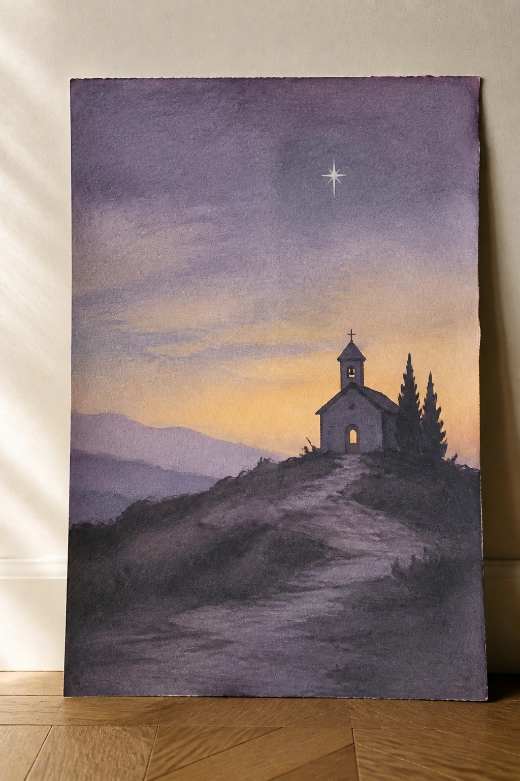 Watercolor painting of a church on a hill beneath a glowing star at twilight