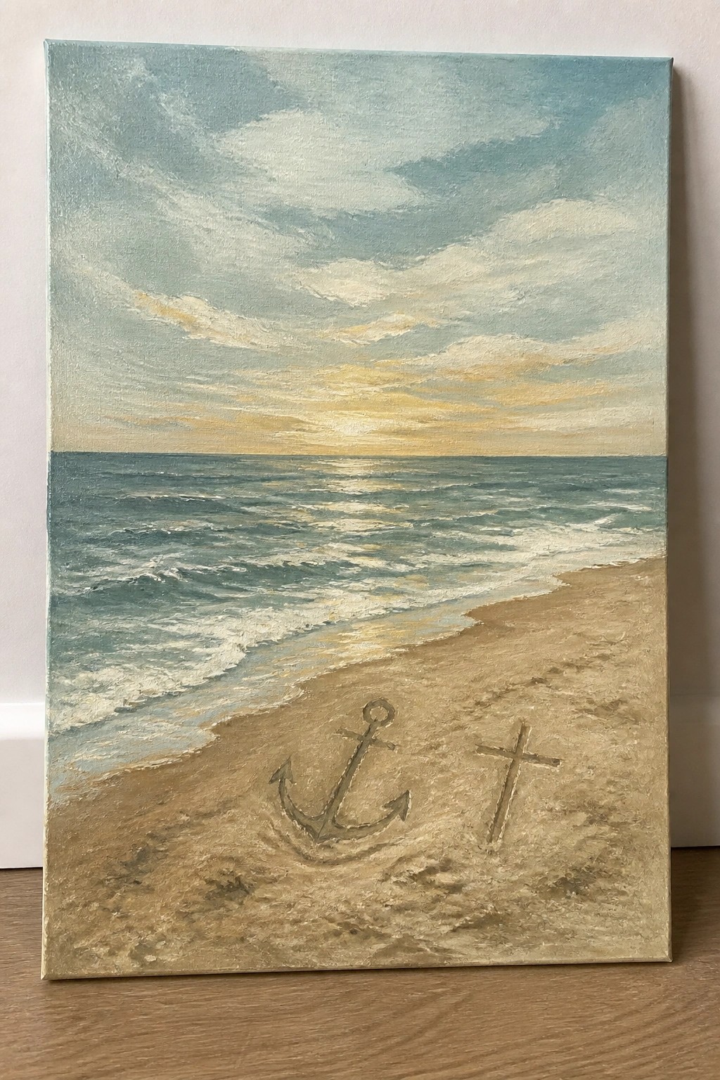 Seascape painting of ocean waves, sandy beach with anchor and cross at sunset