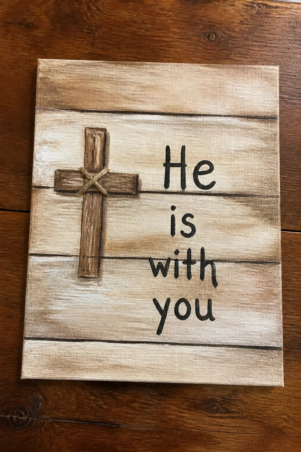 Rustic wooden sign with cross and text 