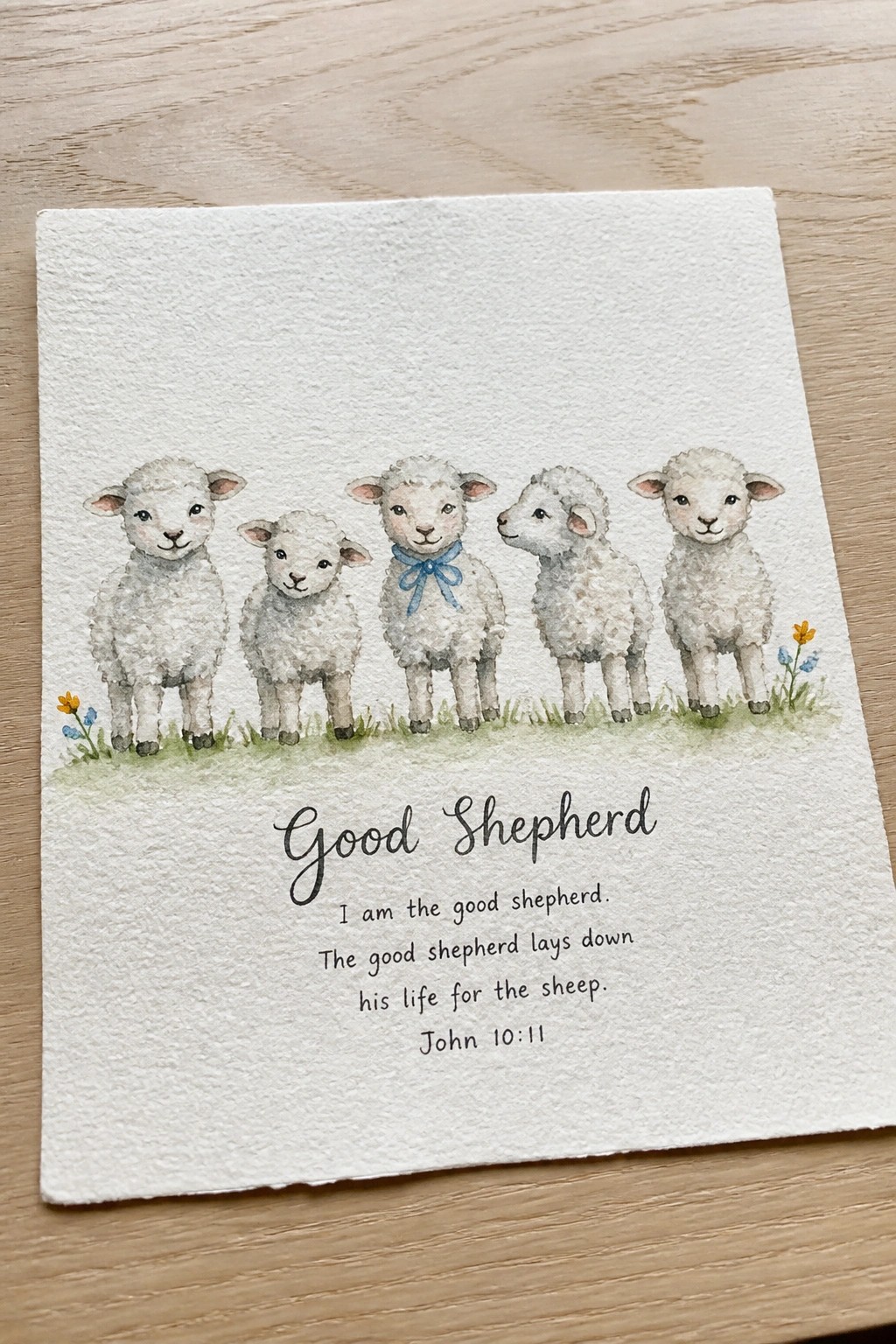 Watercolor of five white sheep on grass with Good Shepherd Bible verse.