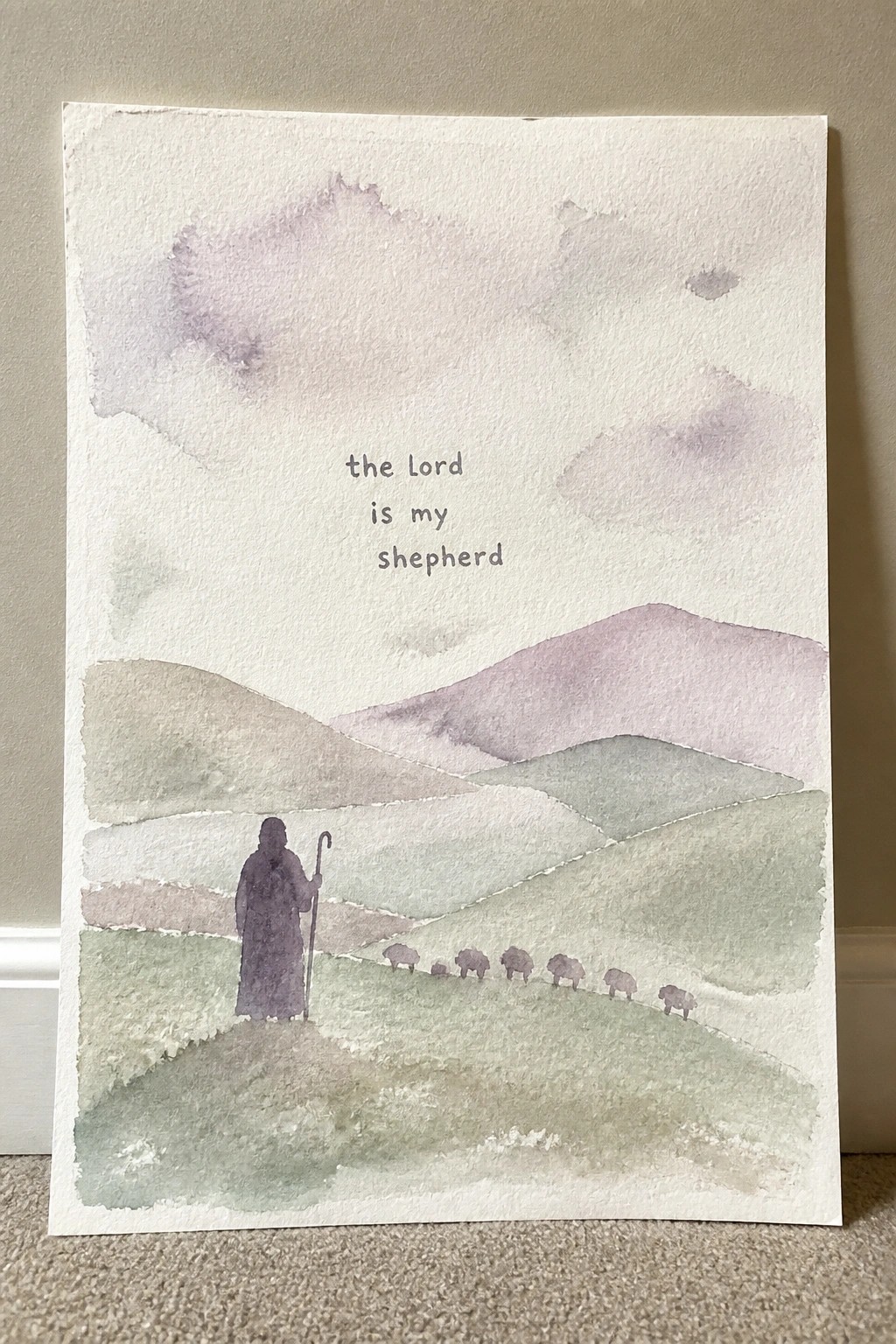 Watercolor shepherd with staff and sheep on pastel hills, text