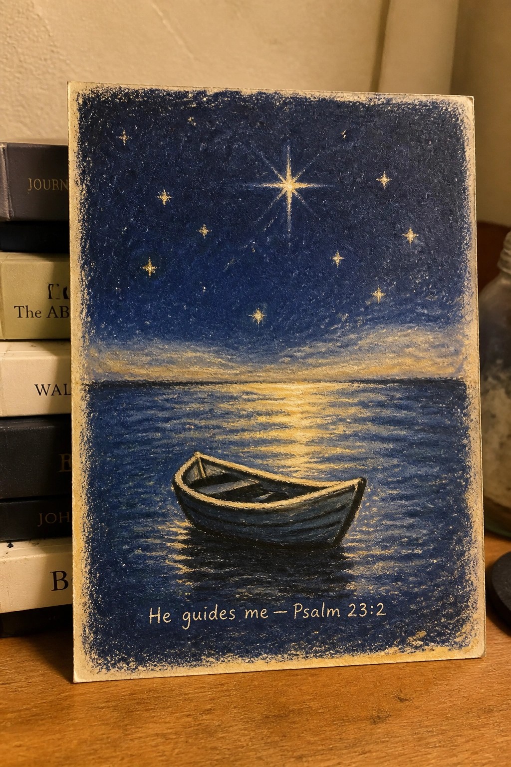 Pastel painting of boat on starry sea with Psalm 23:2 text below