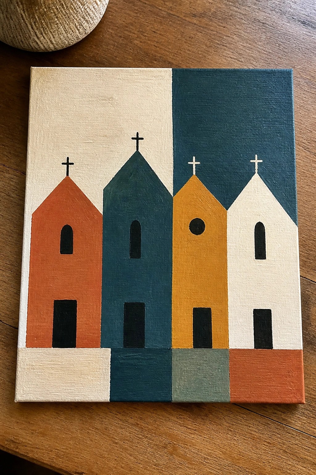 Abstract painting of four colorful churches with crosses on split background.