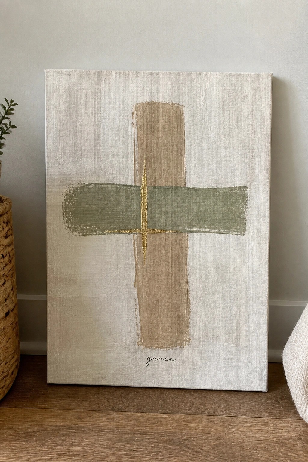 Abstract cross in beige, sage green, and gold on cream canvas with 
