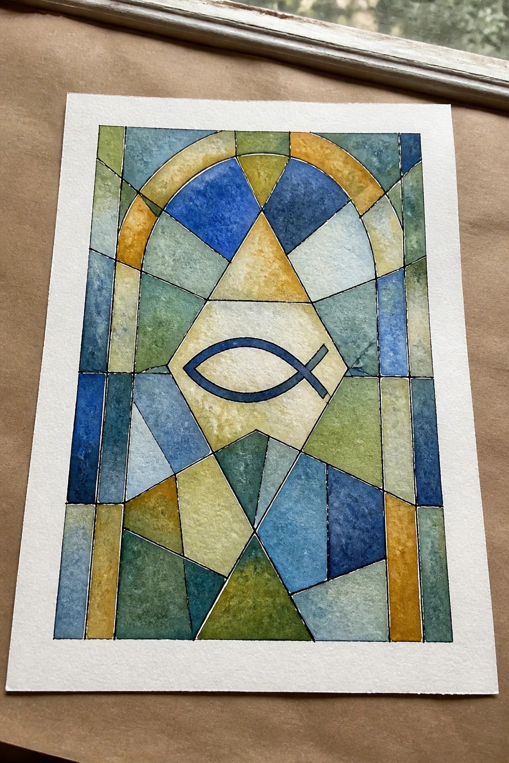 Colorful watercolor mosaic mimicking arched stained glass with central blue fish symbol