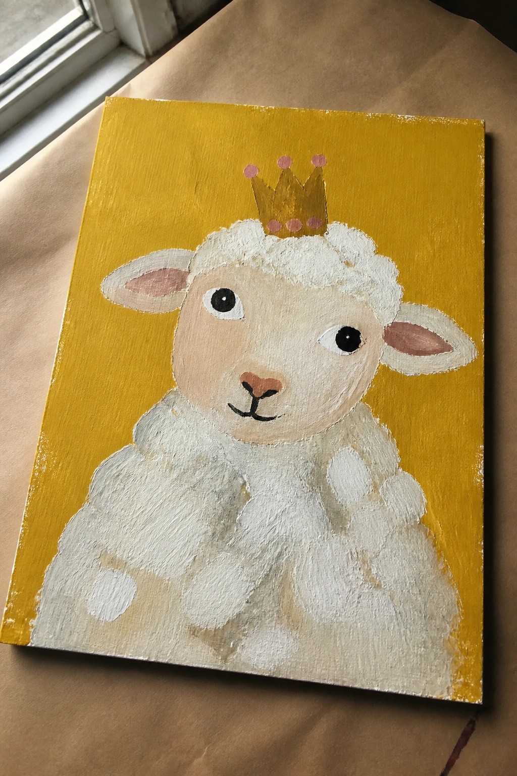 Thickly textured painting of a crowned white lamb on yellow background.