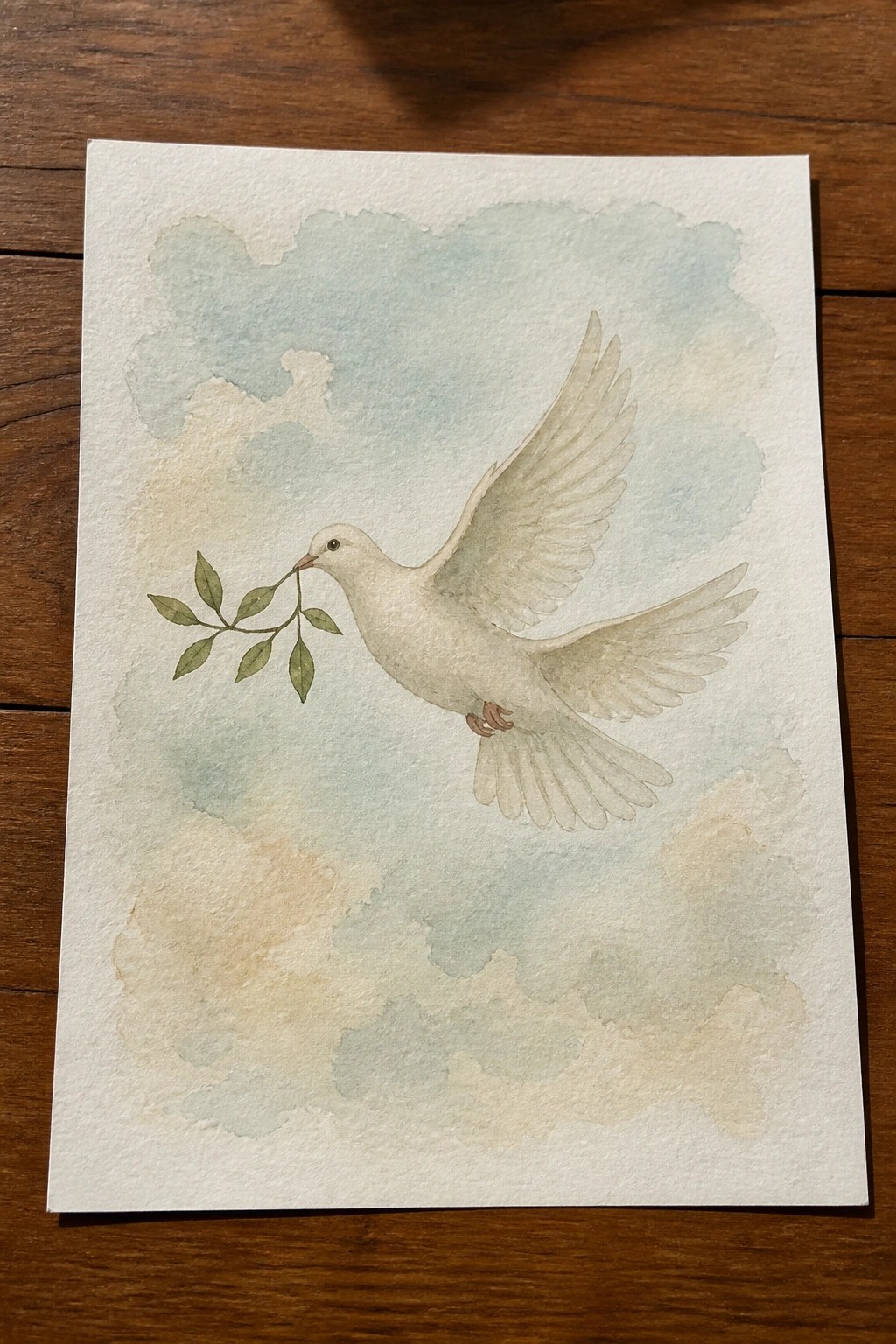 Watercolor of white dove in flight with olive branch against soft pastel clouds