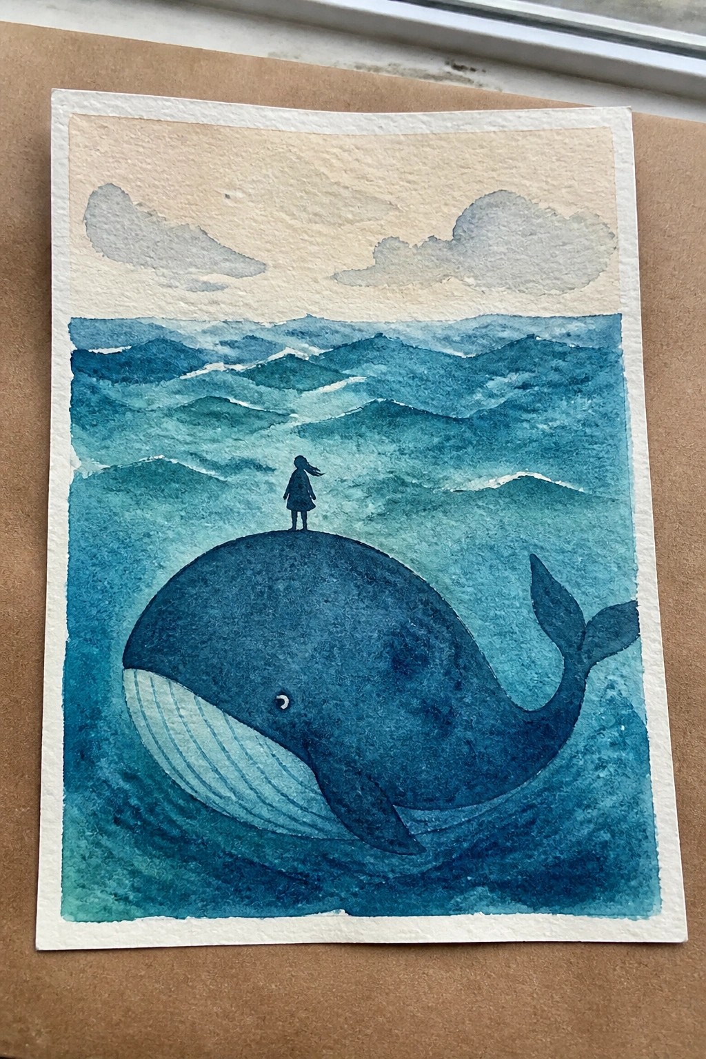 Watercolor of girl in dark dress atop blue whale amid ocean waves under clouds