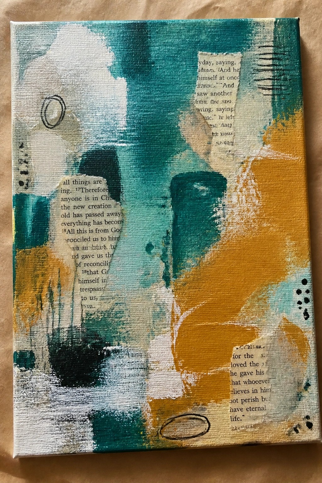 Abstract canvas painting with teal, yellow, and white brushstrokes plus collaged Bible text.