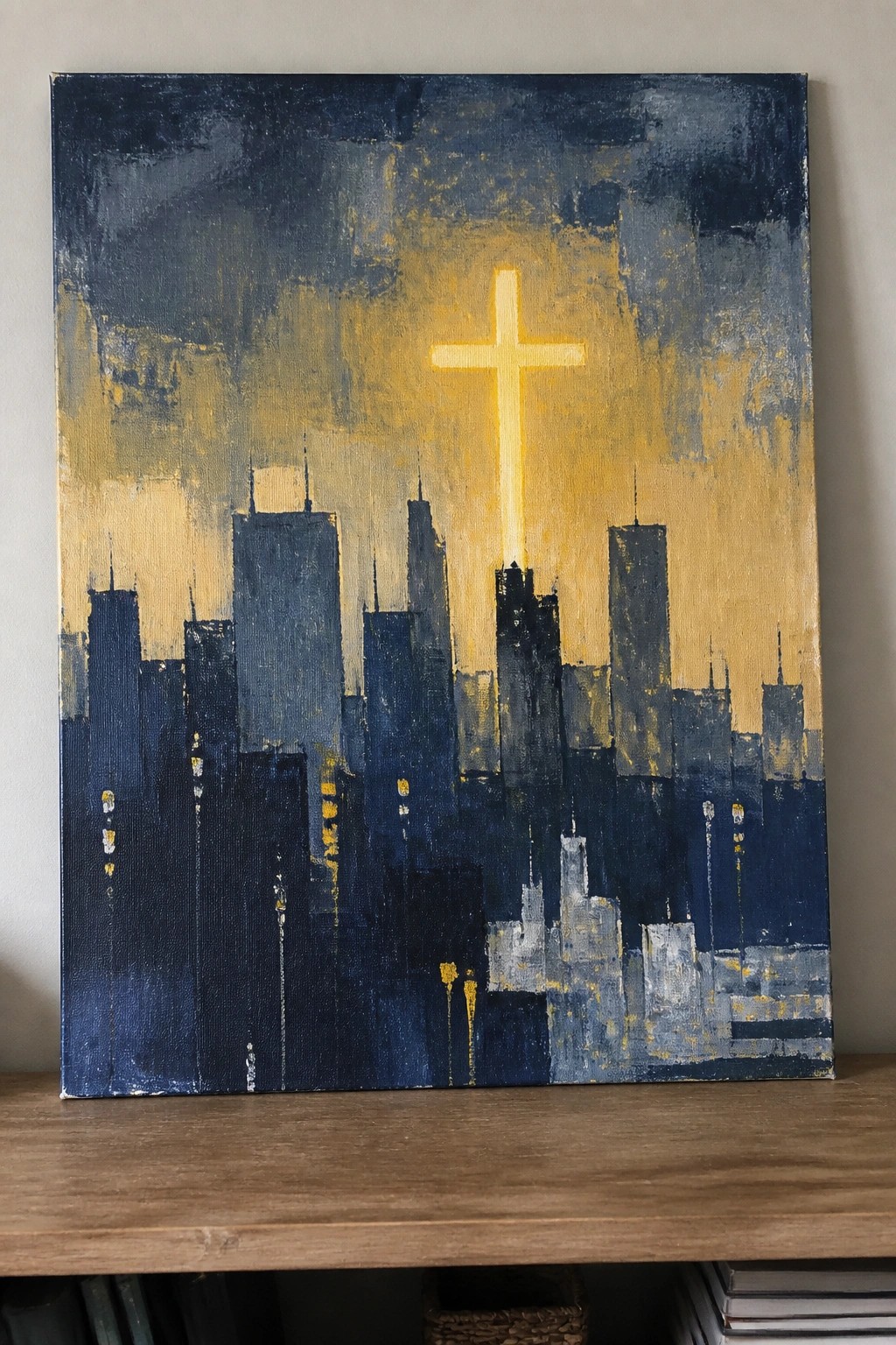 Abstract painting of dark blue city skyline with glowing yellow cross overhead