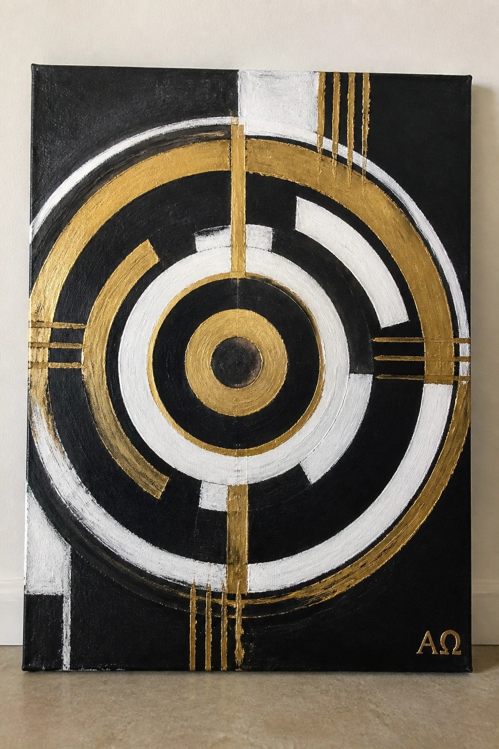 Abstract painting of concentric black, white, and gold circles with vertical lines.