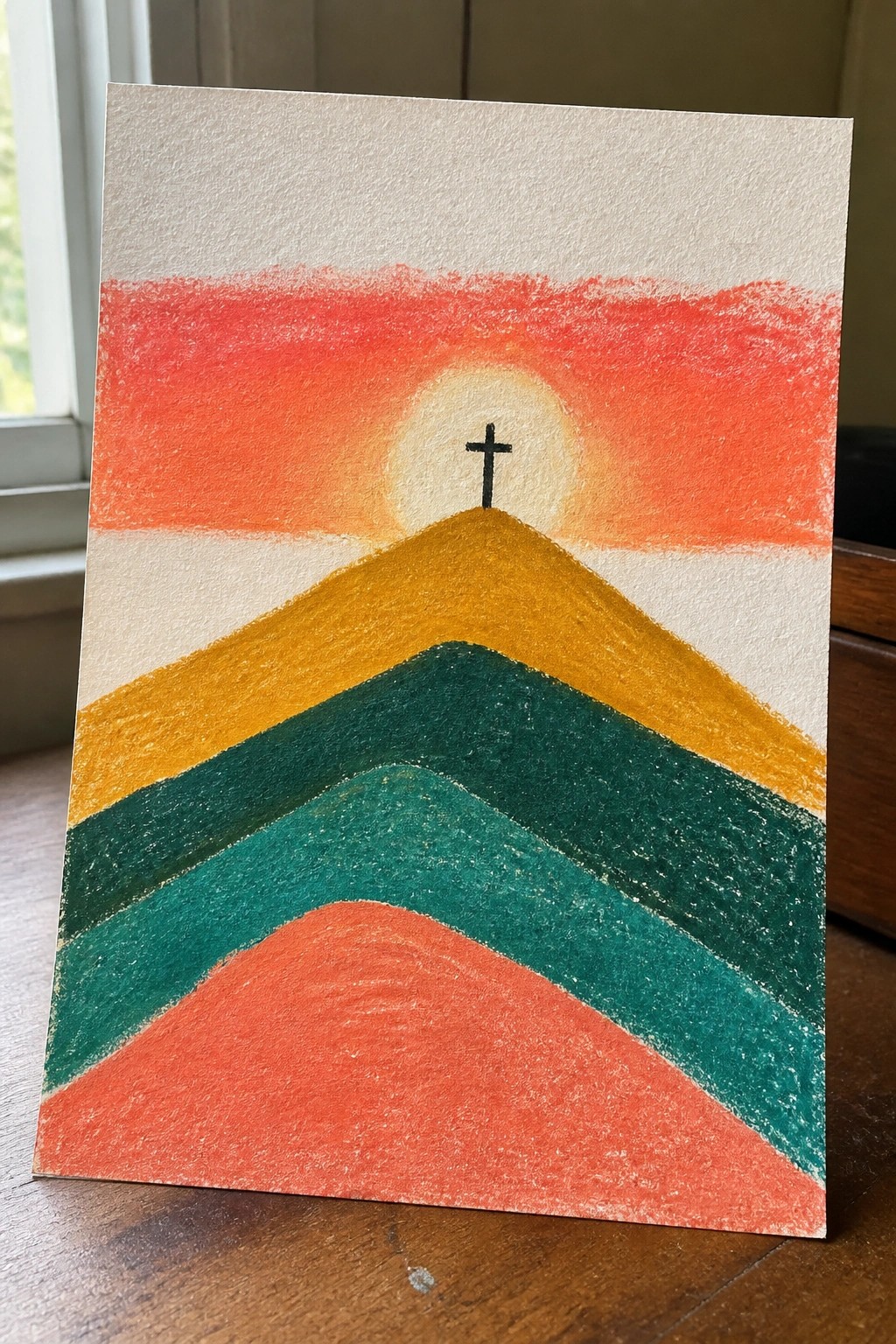 Layered hills in red, teal, yellow and orange with sun and black cross on peak