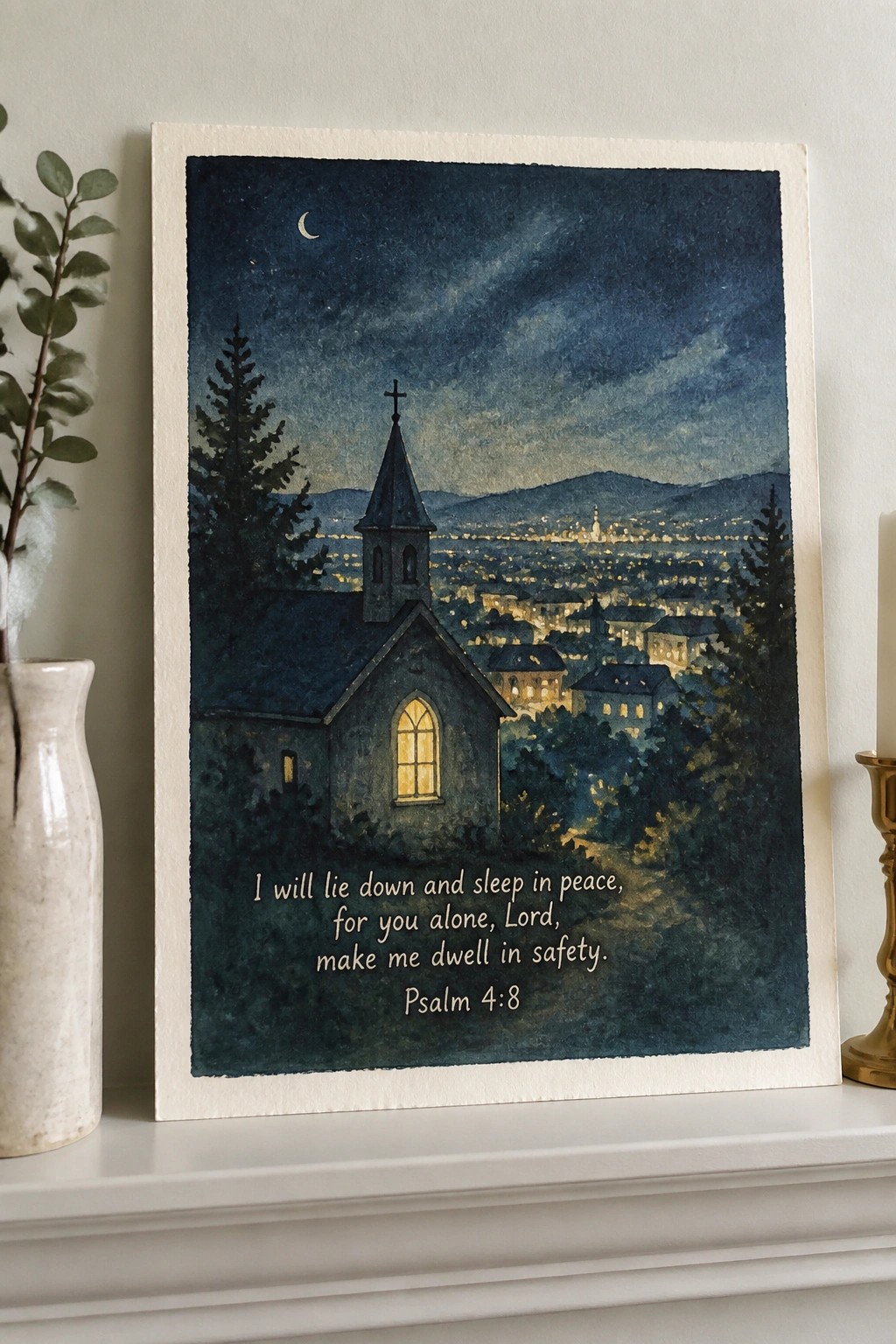 Framed watercolor of nighttime church overlooking glowing town with Psalm 4:8 quote below.