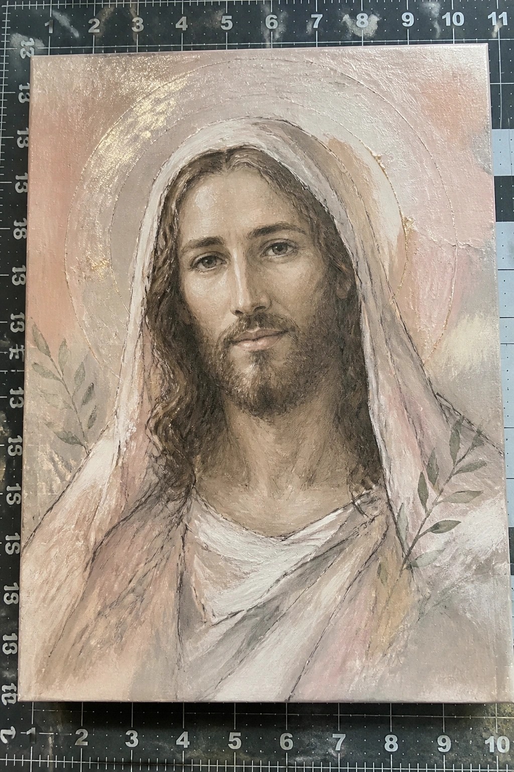 Bearded Jesus in white veil with golden halo and olive branches on pink canvas