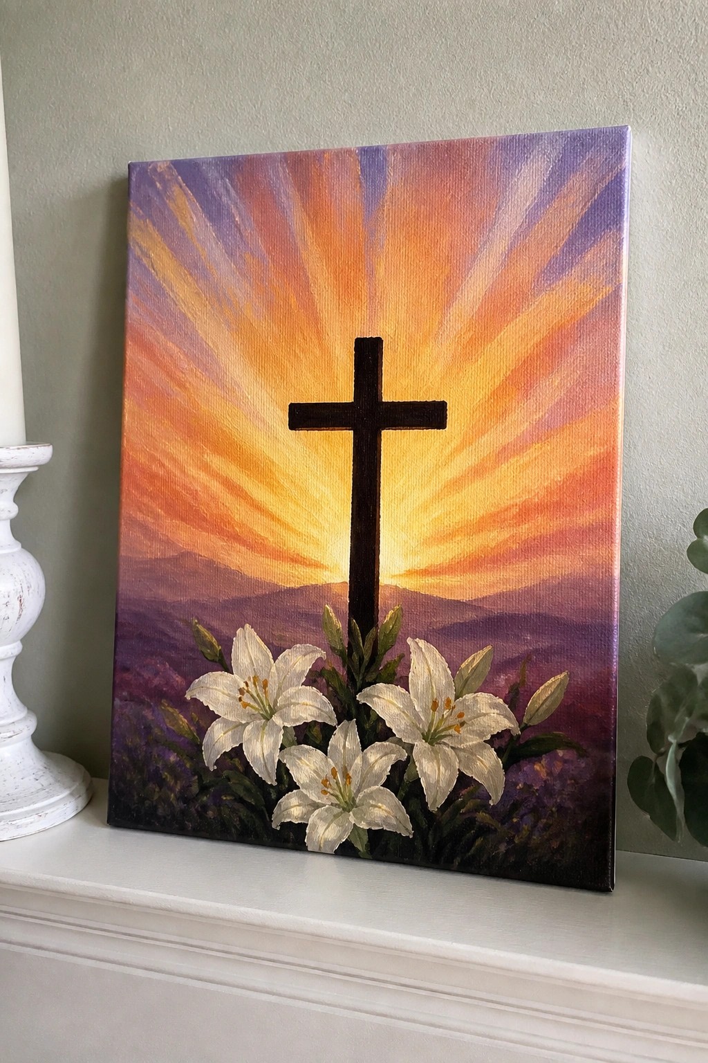 Painting of black cross with white lilies against vibrant orange-purple sunset rays.