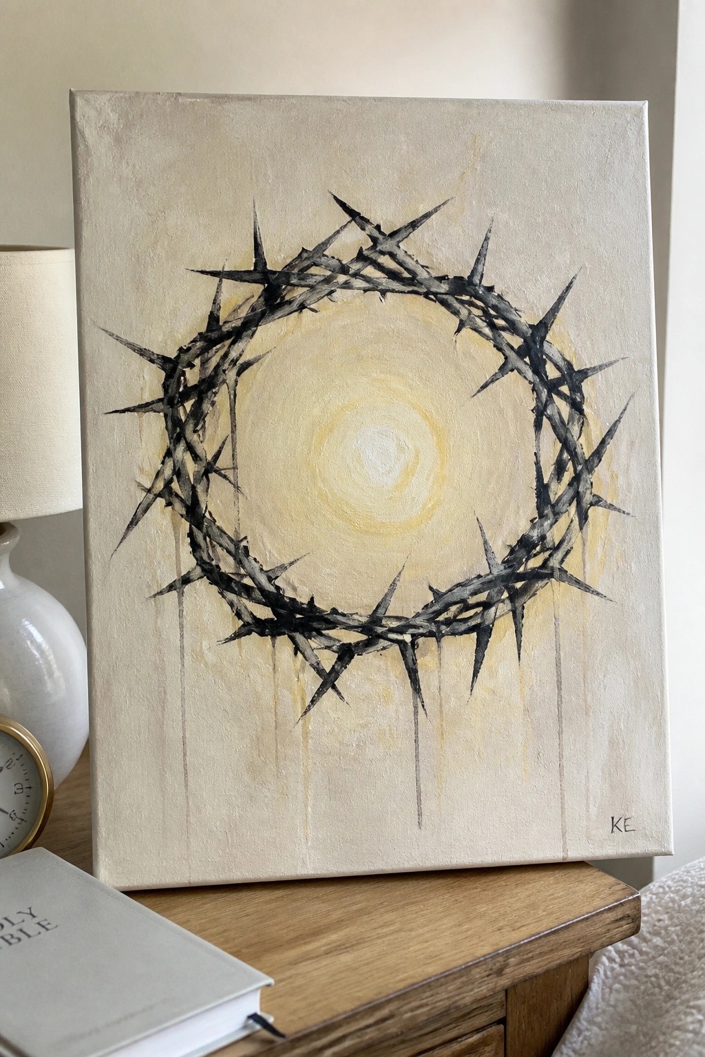 Black crown of thorns painting with yellow halo and drips on canvas
