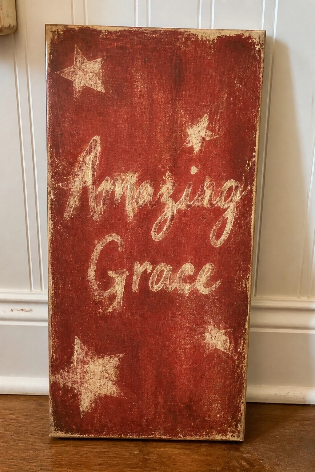 Distressed red wooden sign with 