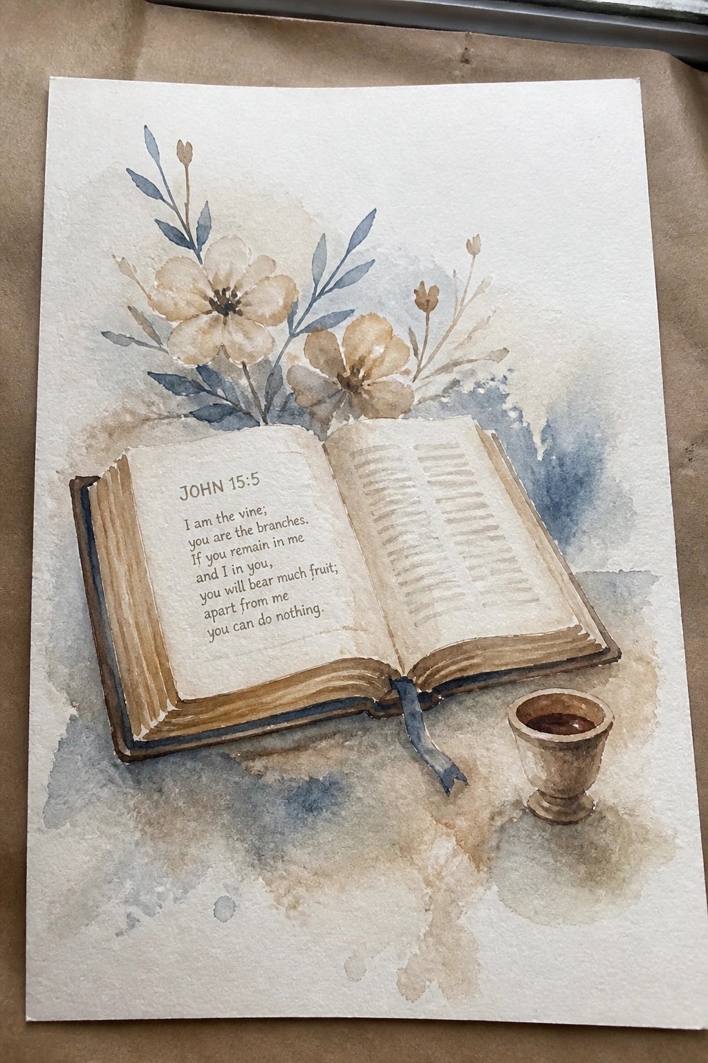 Watercolor painting of open Bible with John 15:5 verse, flowers, and chalice
