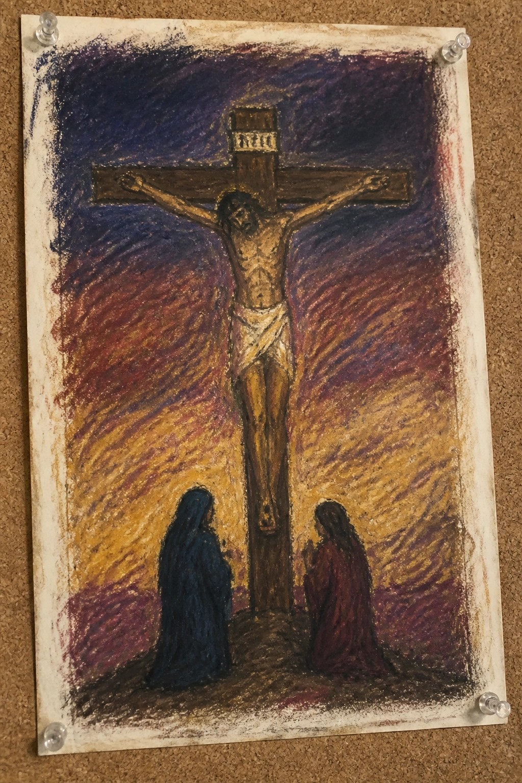 Crayon drawing of Jesus crucified on cross with two robed women kneeling below