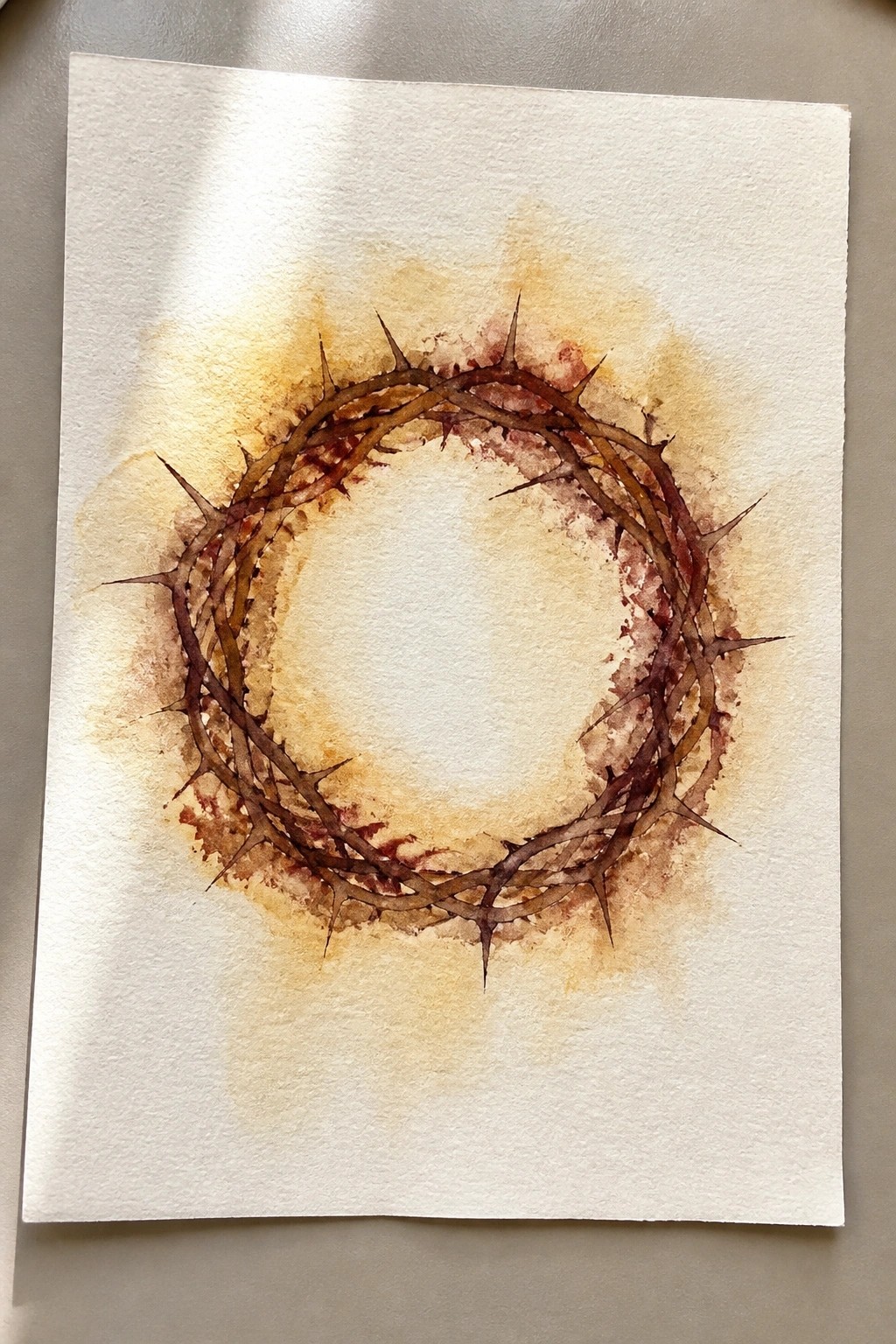 Watercolor painting of thorny crown in brown and red hues on paper