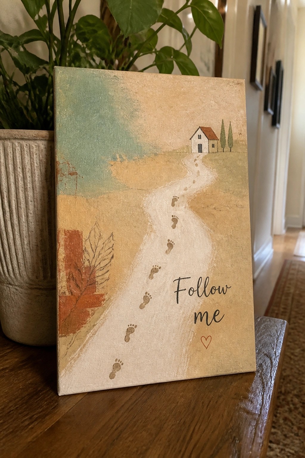 Rustic canvas painting of footprint path leading to house with 