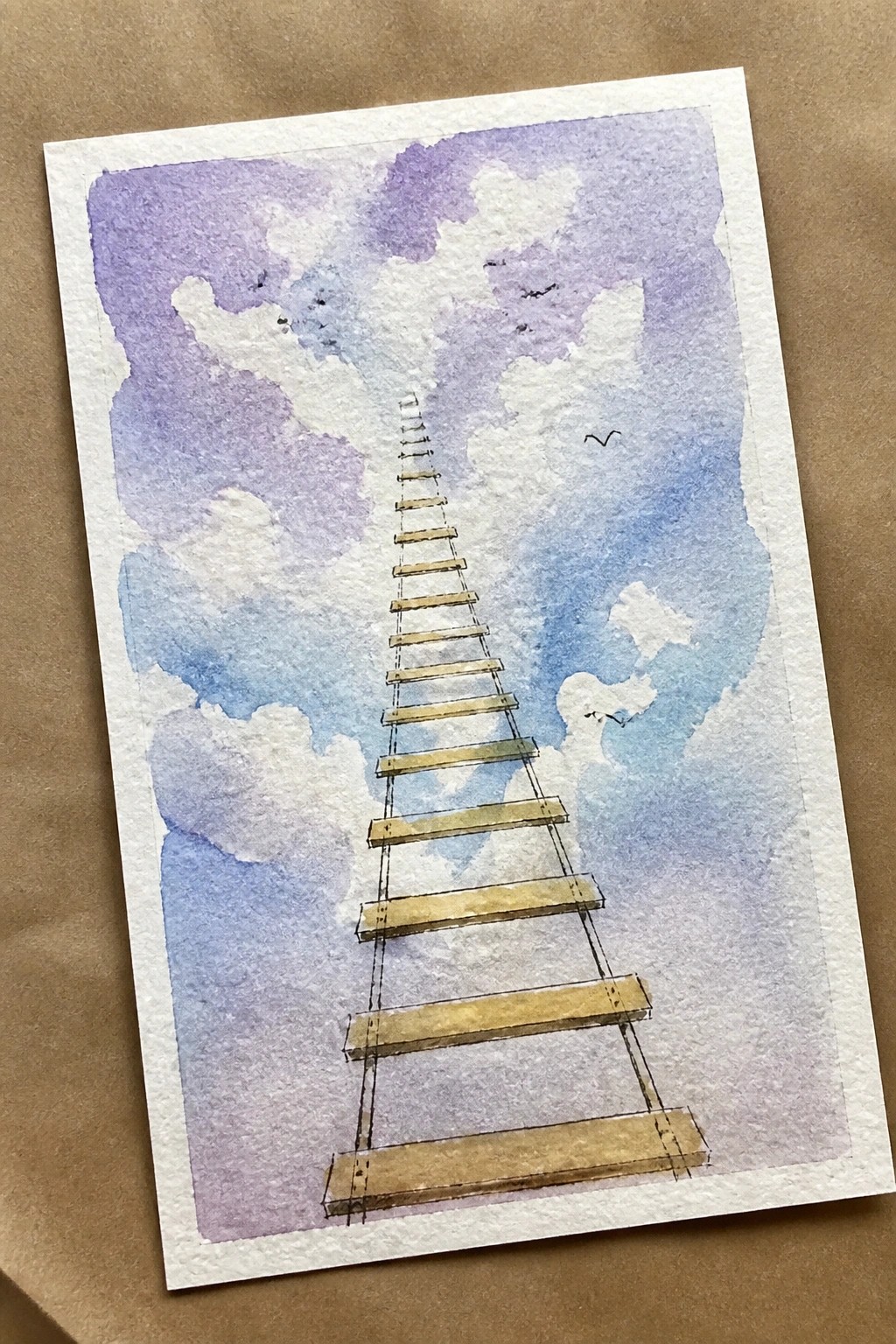 Watercolor painting of a ladder ascending through fluffy clouds in a purple-blue sky with birds.