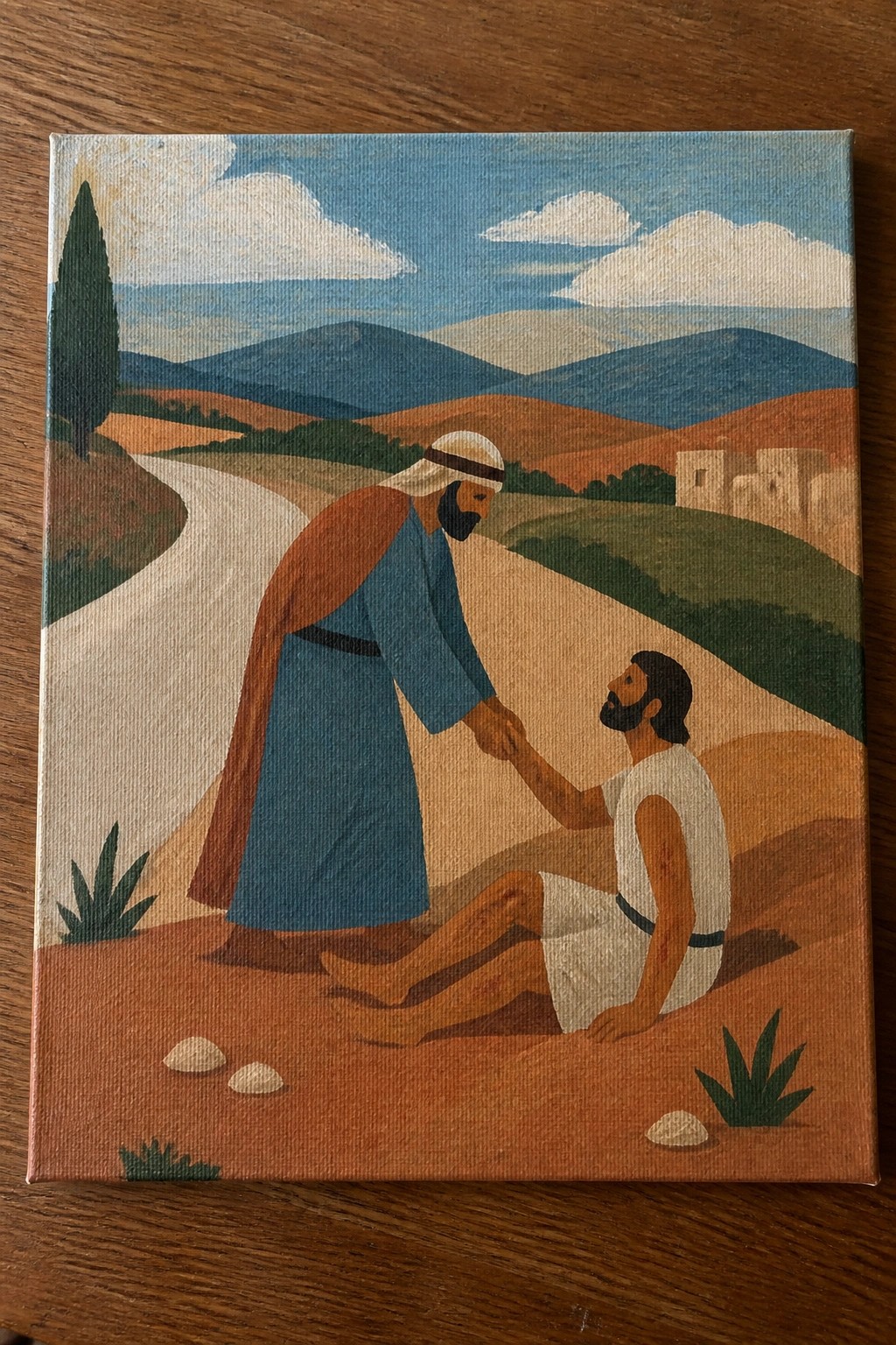 Stylized painting of robed man helping injured traveler on winding hilly path