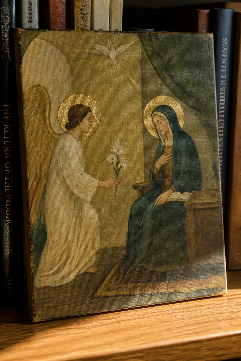 Angel in white offers lilies to blue-robed Mary with dove overhead and golden halos