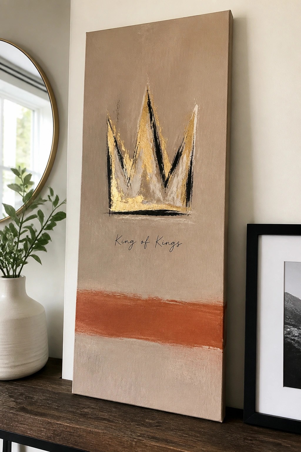Beige abstract painting with gold crown above 