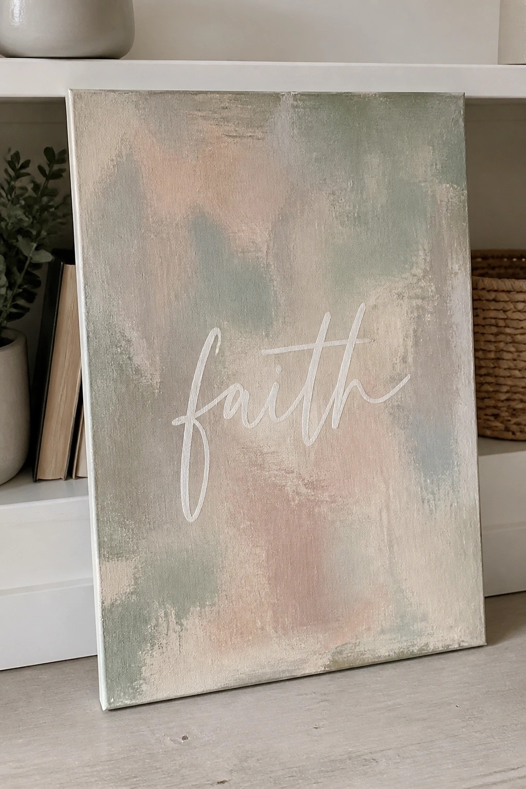 Abstract canvas with soft pastel tones and white cursive 