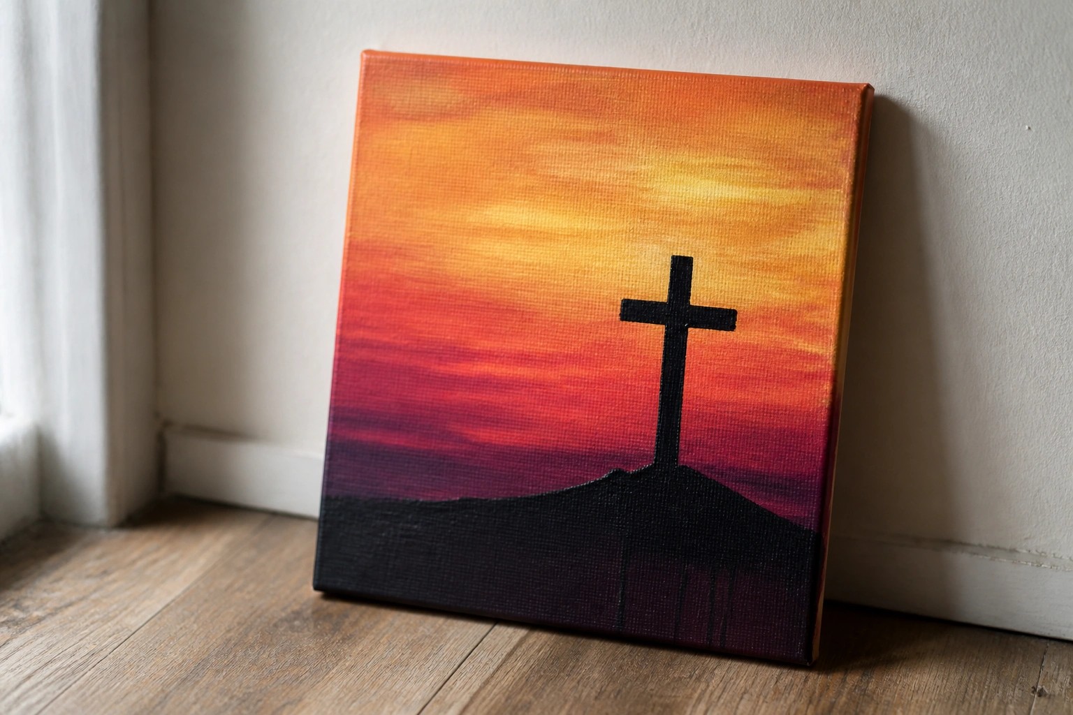 Black cross silhouette on dark hill under vibrant orange-yellow-red sunset sky on canvas.