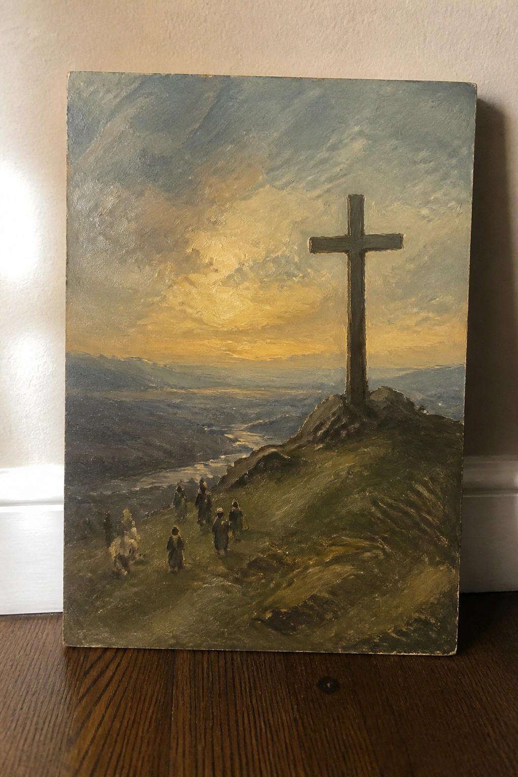 Dramatic oil painting of robed figures approaching a large wooden cross on a hill at sunset.