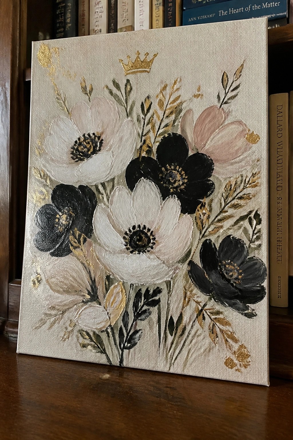 Floral canvas painting with white black and pink blooms plus gold crown and accents