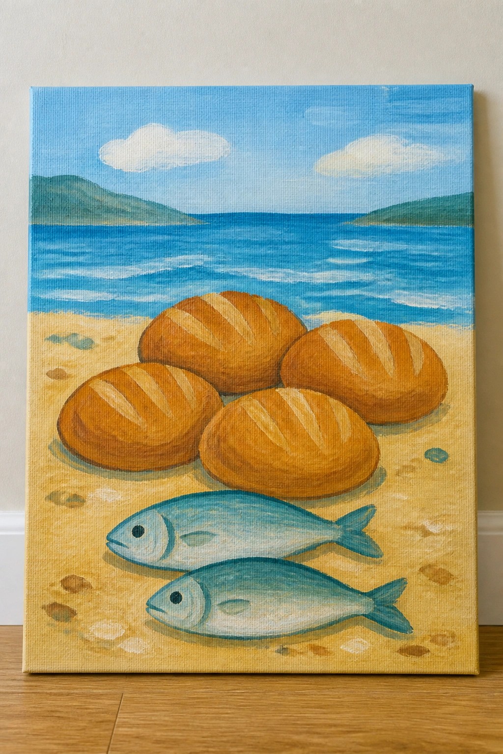 Four golden bread loaves and two blue fish on a sandy beach by the sea