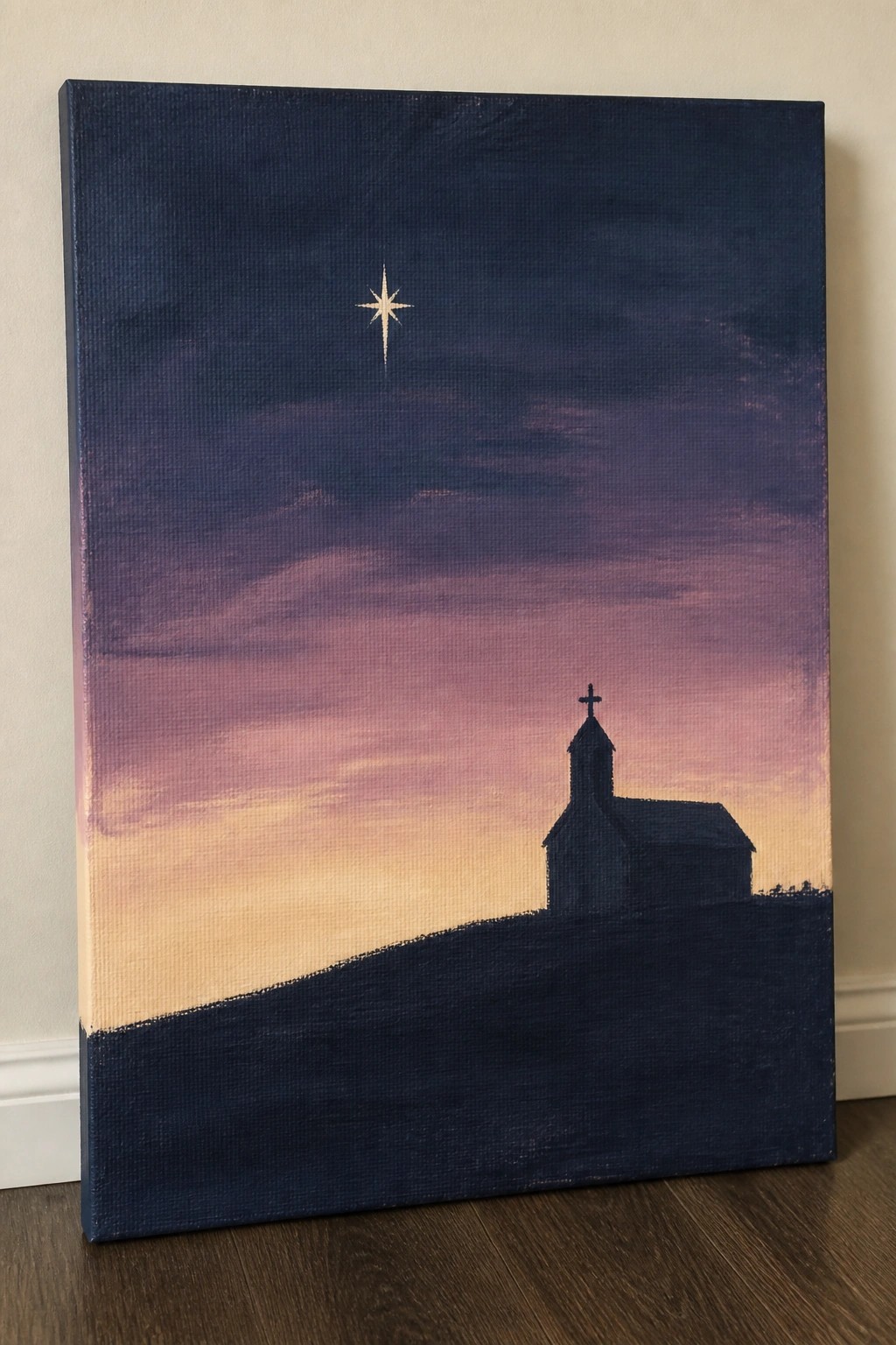 Silhouetted church on hill under purple-orange gradient sky with bright shining star.