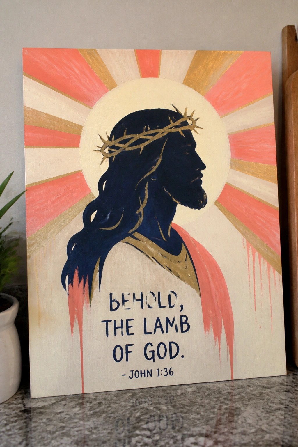 Profile painting of Jesus with thorny crown, halo, amid red-gold sun rays and biblical quote.