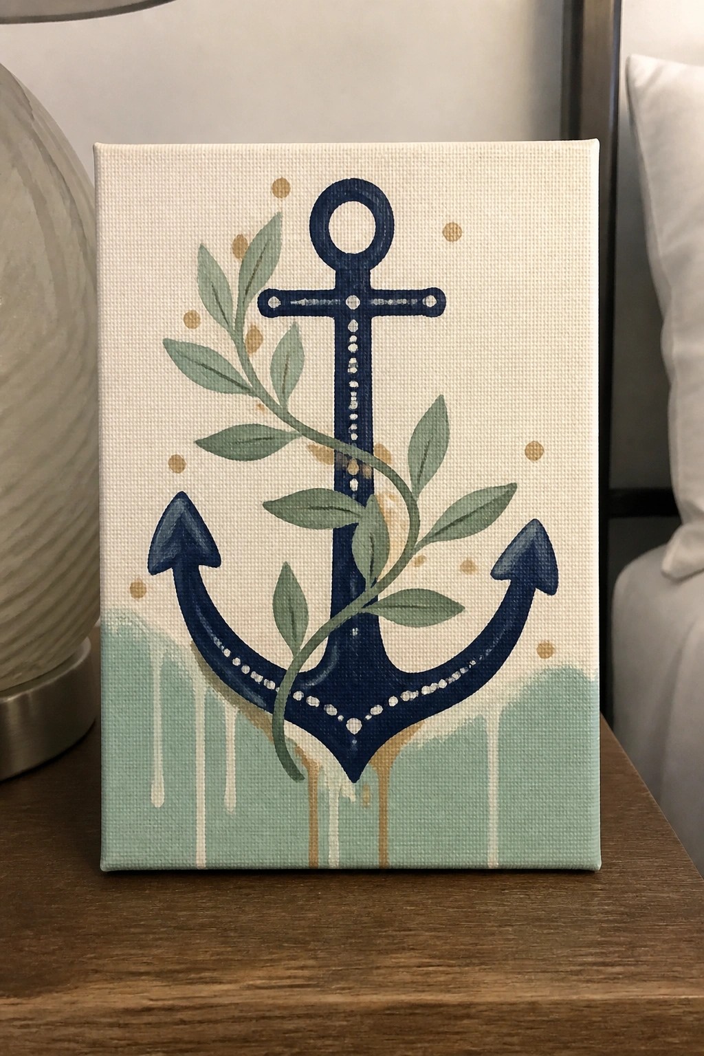 Navy blue anchor canvas painting wrapped in green vines with gold dots and green drips