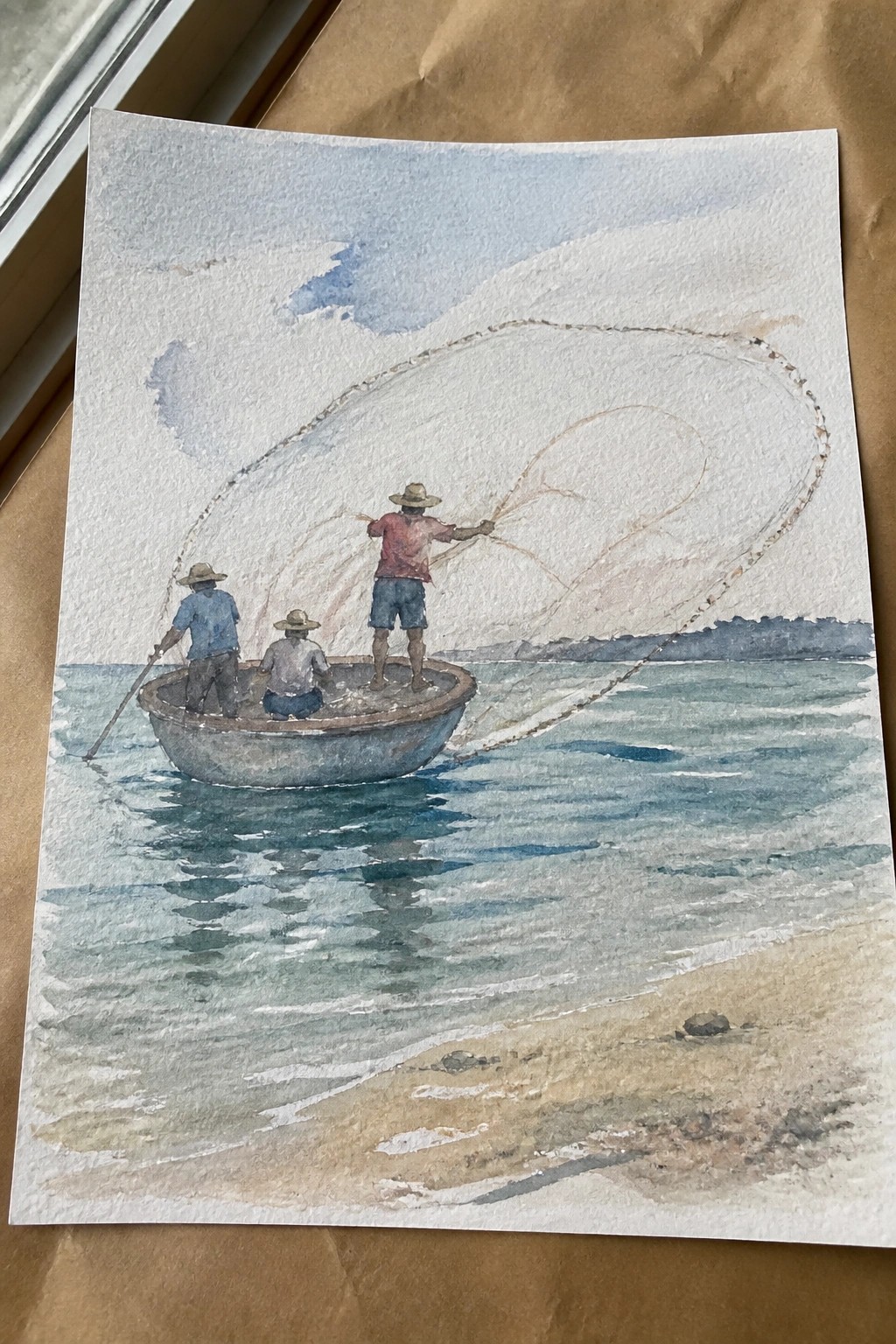 Three fishermen in hats casting a large net from a small boat on blue water, watercolor style
