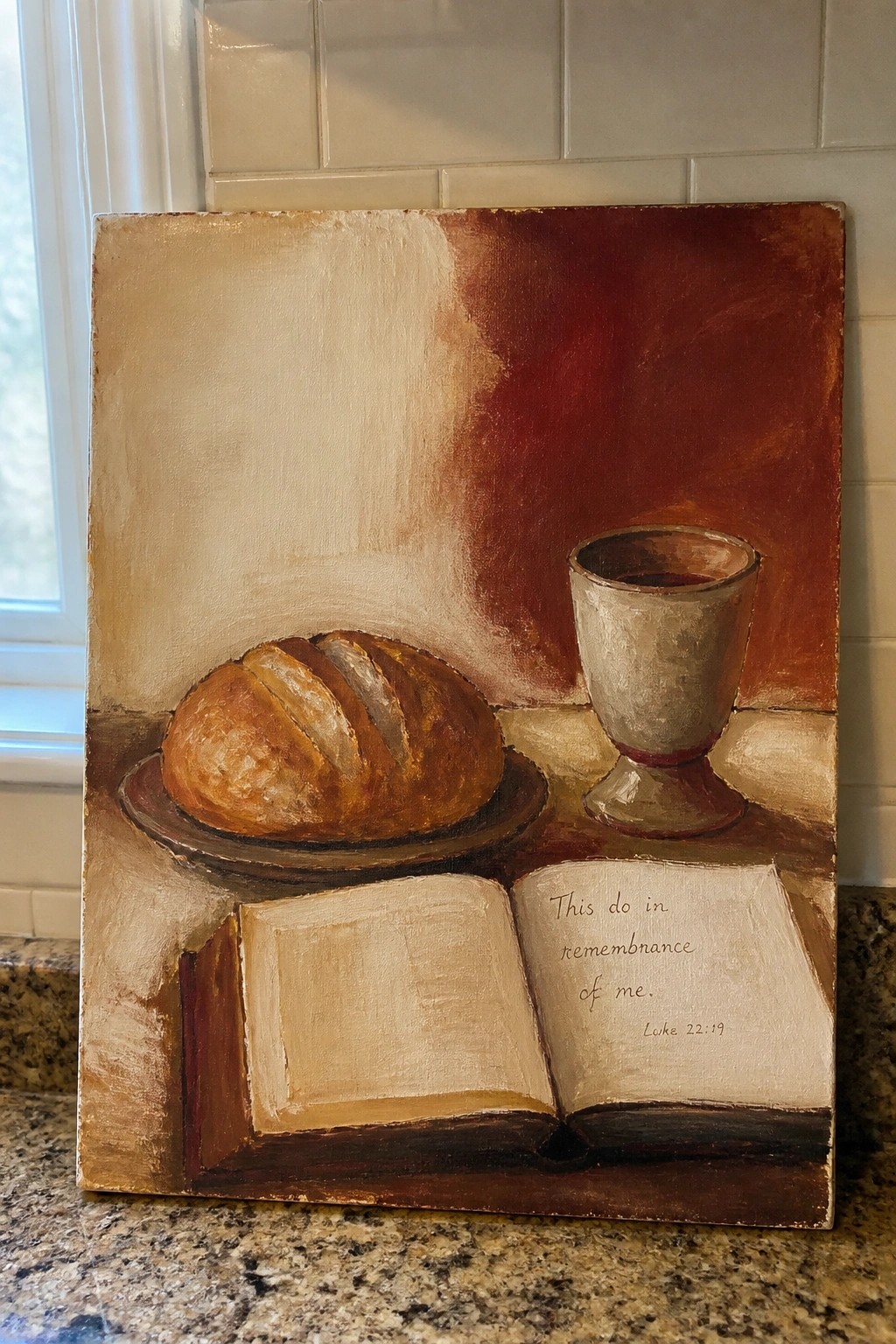 Still-life painting of bread loaf, wine goblet, and open Bible on table
