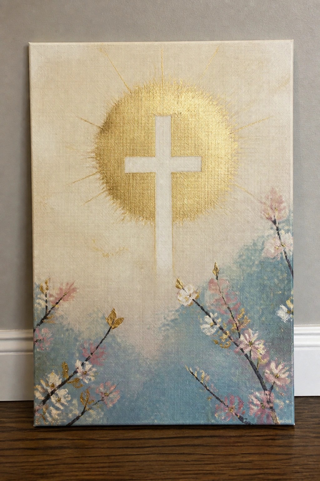 White cross over golden sunburst with pink cherry blossoms on blue background.