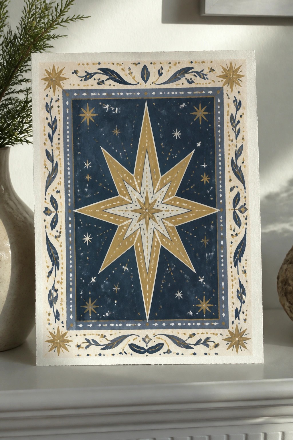 Golden star on deep blue background with ornate gold-blue floral borders on shelf.